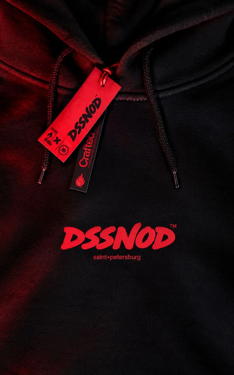 A black hoodie with a red DSSNOD print and a red hang tag