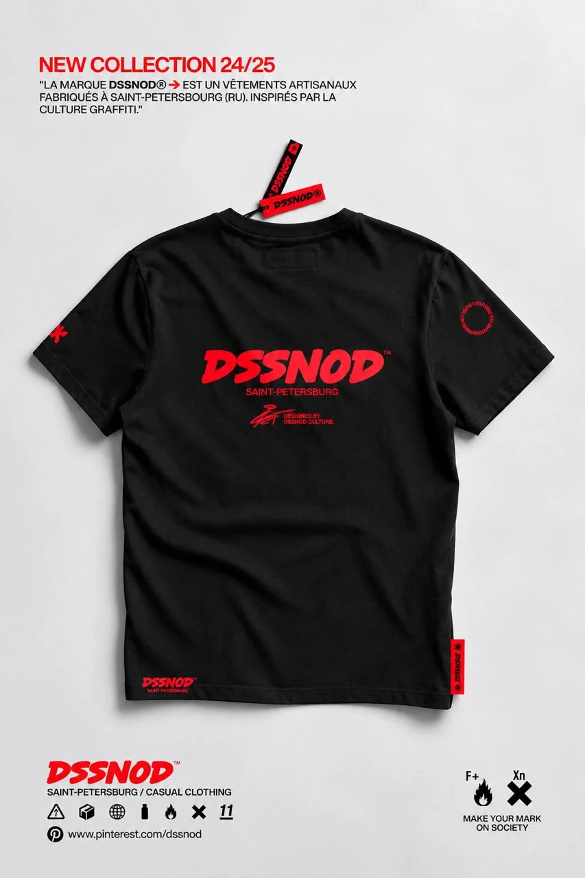 A black DSSNOD t-shirt laid flat with red print, tags and a collection announcement