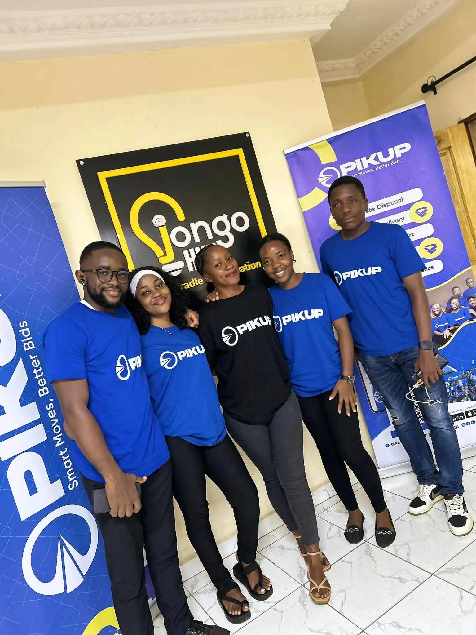Five members of the PIKUP team standing together at a hub event